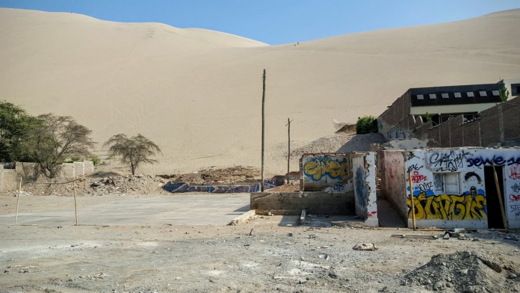 Soccer. The dunes seem to want to engulf the village