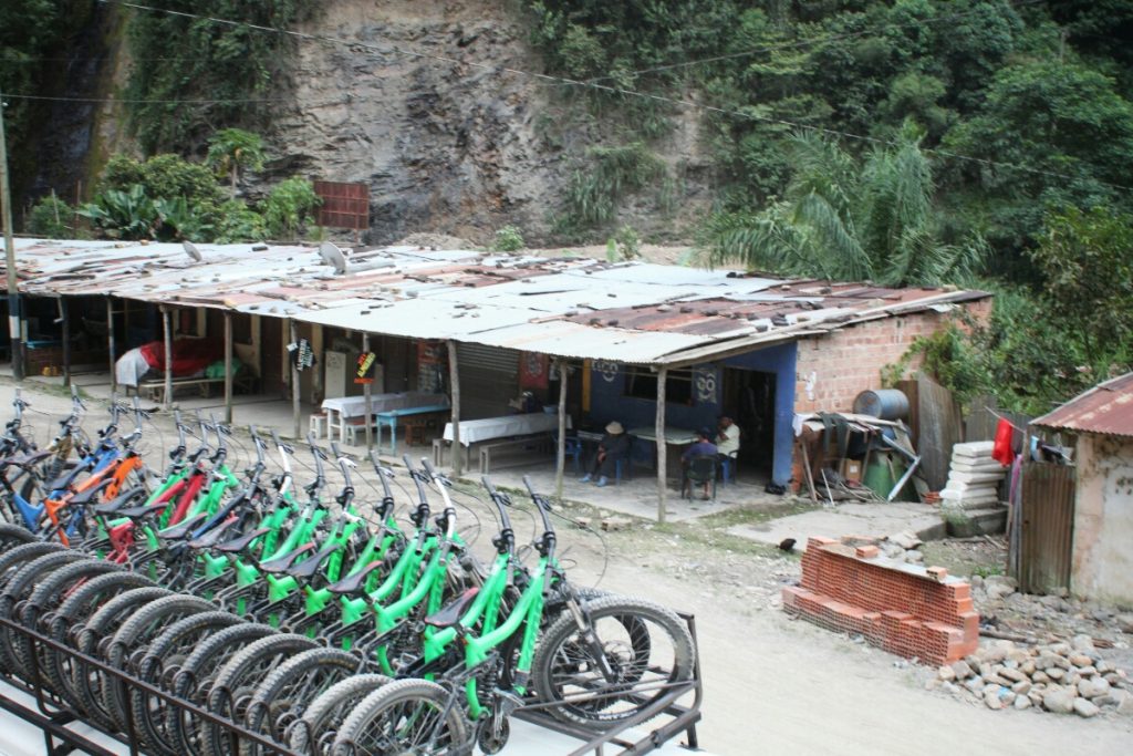 Bikes stacked up, beer in hand