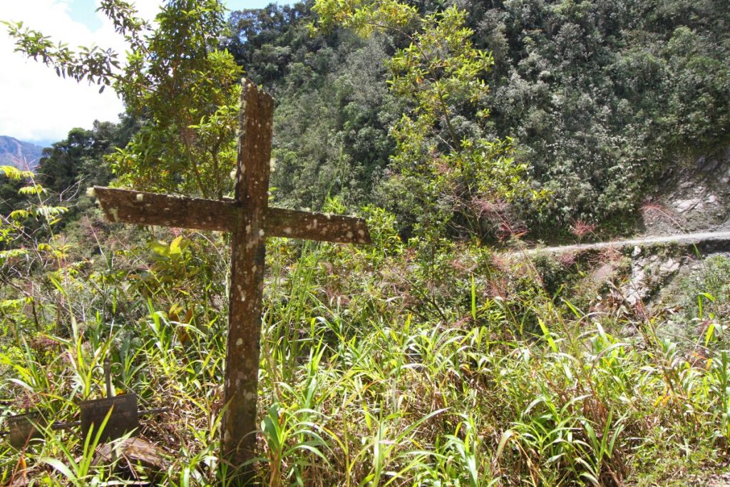 The road is scattered with crosses